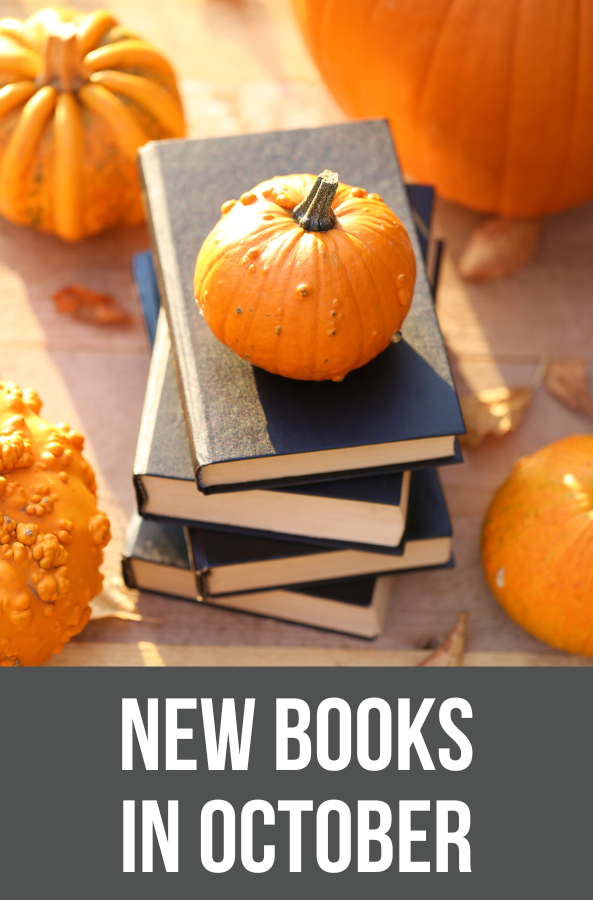 new books in october with stack of books surrounded by pumpkins