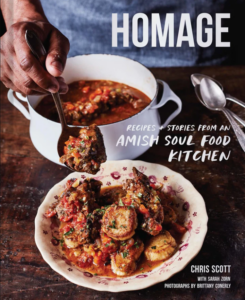 Front cover of Homage showing a person in an apron dishing a stew from the pot into a bowl