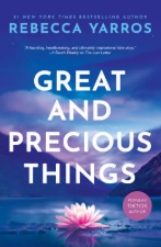 Front cover of Great and Precious Things showing a pink flower floating on calm water between two sloping mountains