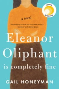 Front cover of Elinor Oliphant, an illustration of a woman standing, showing her neck to her legs. She's wearing an orange shirt and brown skirt; her arms are crossed in front of her. She has brown hair, barely visible, to her shoulders.