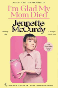 Front cover of I'm Glad My Mom Died showing a picture of the author, holding a pink urn and smiling