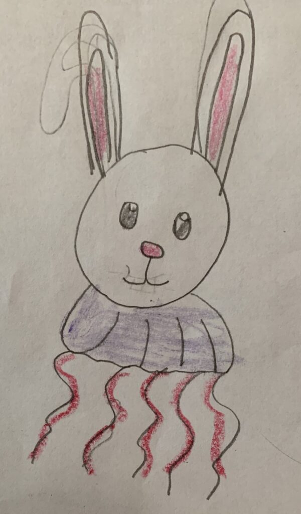 Crayon drawing of a bunny head, but its body is a purple jellyfish with pink tentacles.