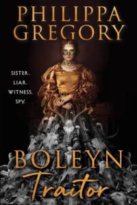 Book cover with woman in ornate gold attire and mask stands behind a pile of animal skulls, with the words: Sister. Liar. Witness. Spy.