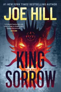 Fiery red demonic face with sharp features and glowing eyes emerging from behind large, bold title text on the book cover.