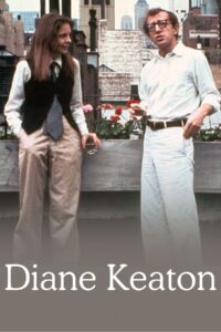 Still from Annie Hall showing Keaton and Allen talking with each other on a New York City rooftop, with apartment buildings in the background