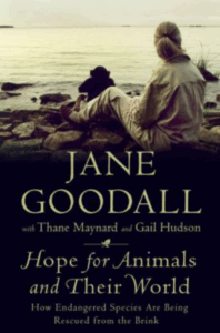 Photo of Goodall sitting with a small chimp near a lakeshore, looking at the water, featured on a book cover.