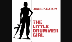 Silhouette of a woman wearing army fatigues and holding a rifle in a down postition, with the other hand on her hip