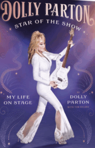Dolly Parton in a white outfit holding a guitar, standing and smiling on a colorful illustrated book cover.