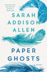 Book cover design featuring large blue feathers on a light background.