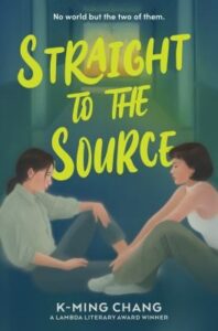 Two people sit facing each other on the floor in a dimly lit hallway, with bold, colorful text overlaid on the book cover.